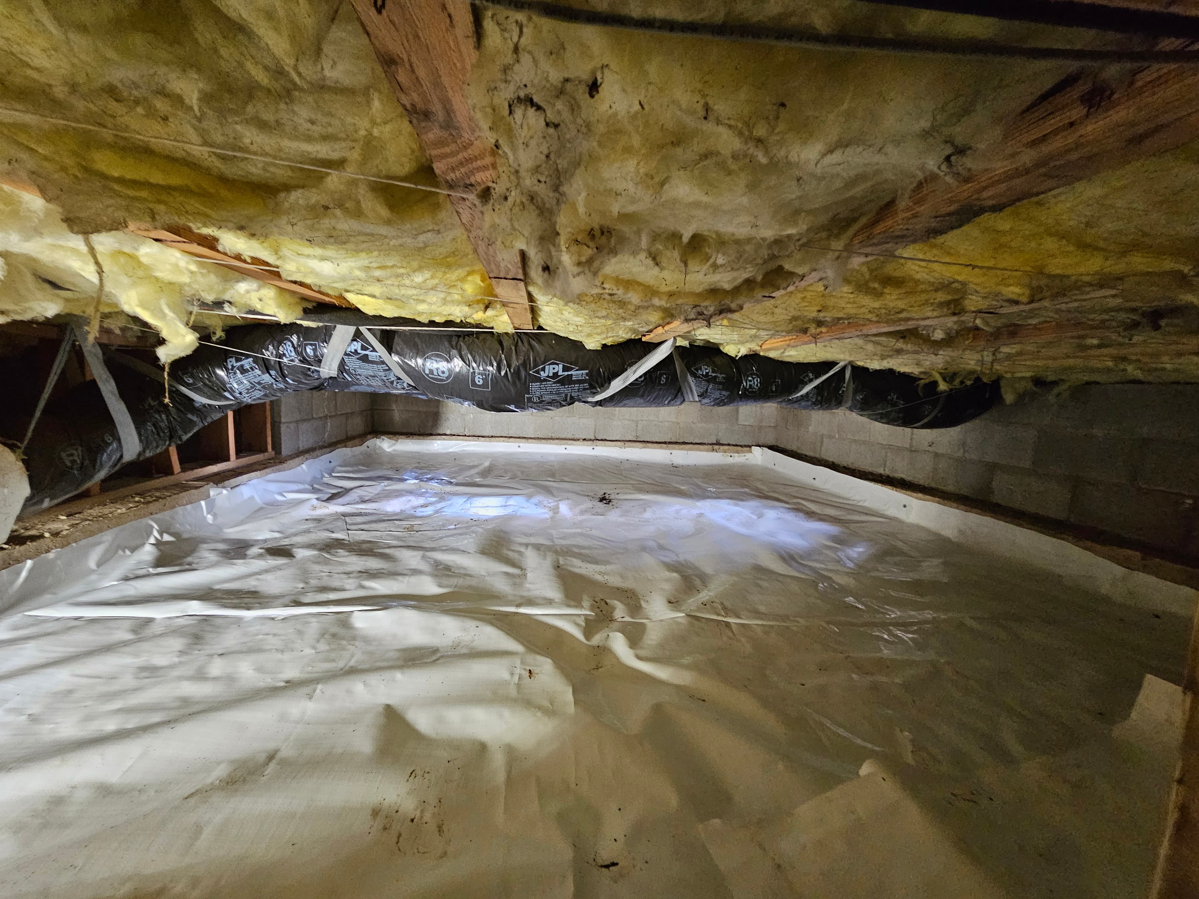 crawl space with insulation and vapor barrier